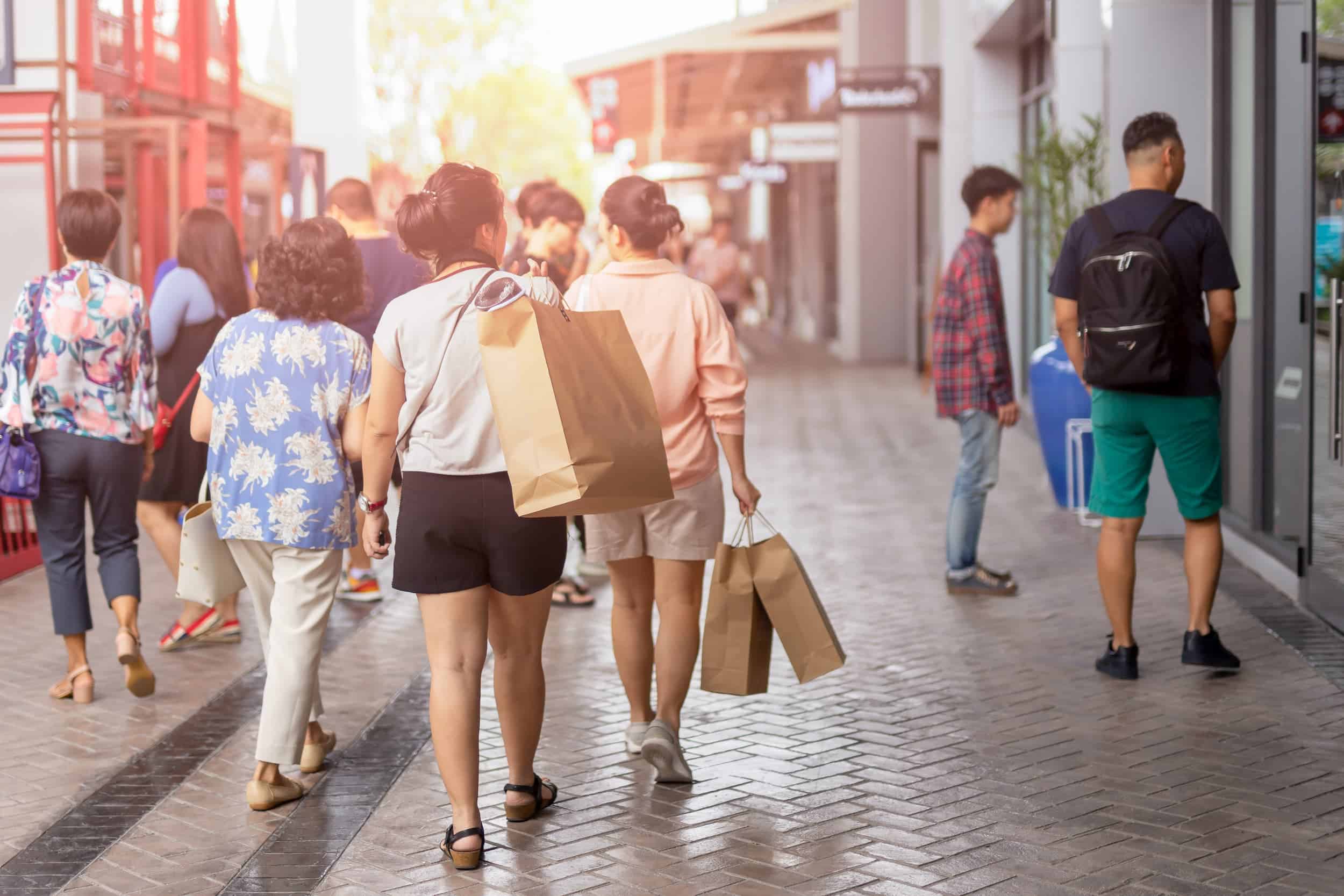 Shoppers walking along Queen Street Mall