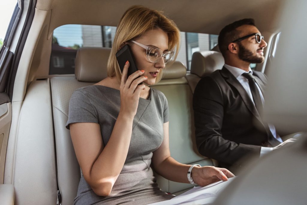 Executives in the back of a limousine